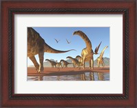 Framed Two Deinocheirus move along with a herd of Argentinosaurus