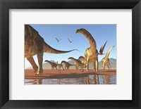 Framed Two Deinocheirus move along with a herd of Argentinosaurus