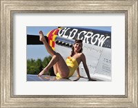 Framed Cute pin-up girl sitting on the wing of a P-51 Mustang