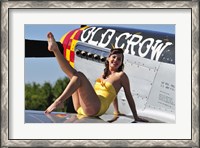 Framed Cute pin-up girl sitting on the wing of a P-51 Mustang