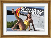 Framed Cute pin-up girl sitting on the wing of a P-51 Mustang