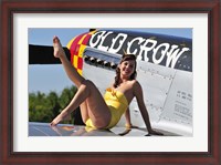 Framed Cute pin-up girl sitting on the wing of a P-51 Mustang