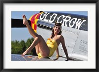 Framed Cute pin-up girl sitting on the wing of a P-51 Mustang