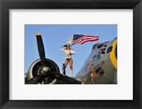 Framed 1940's style majorette pin-up girl on a B-17 bomber with an American flag