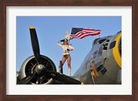 Framed 1940's style majorette pin-up girl on a B-17 bomber with an American flag