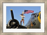 Framed 1940's style majorette pin-up girl on a B-17 bomber with an American flag