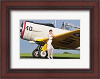 Framed 1940's style Navy pin-up girl leaning on the wing of a T-6 Texan