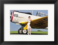 Framed 1940's style Navy pin-up girl leaning on the wing of a T-6 Texan