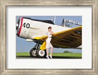 Framed 1940's style Navy pin-up girl leaning on the wing of a T-6 Texan