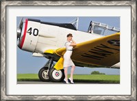 Framed 1940's style Navy pin-up girl leaning on the wing of a T-6 Texan