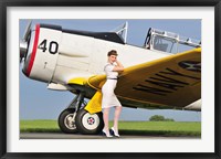 Framed 1940's style Navy pin-up girl leaning on the wing of a T-6 Texan