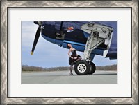 Framed 1940's style pin-up girl resting on the wheel of a TBM Avenger