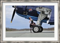 Framed 1940's style pin-up girl resting on the wheel of a TBM Avenger