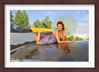 Framed 1940's style pin-up girl with parasol on a vintage P-51 Mustang