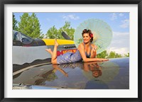 Framed 1940's style pin-up girl with parasol on a vintage P-51 Mustang