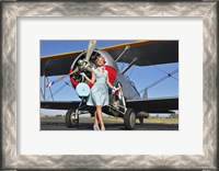 Framed Elegant 1940's style pin-up girl standing in front of an F3F biplane