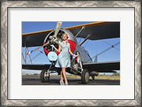 Framed Elegant 1940's style pin-up girl standing in front of an F3F biplane