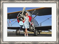 Framed Elegant 1940's style pin-up girl standing in front of an F3F biplane