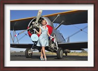 Framed Elegant 1940's style pin-up girl standing in front of an F3F biplane