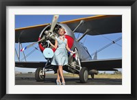 Framed Elegant 1940's style pin-up girl standing in front of an F3F biplane