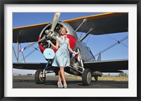 Framed Elegant 1940's style pin-up girl standing in front of an F3F biplane