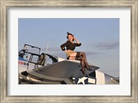 Framed Pin-up girl sitting on the wing of a P-51 Mustang