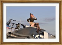 Framed Pin-up girl sitting on the wing of a P-51 Mustang