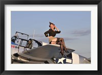Framed Pin-up girl sitting on the wing of a P-51 Mustang