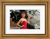 Framed Redhead pin-up girl in 1940's style dancer attire holding on to a vintage aircraft propeller