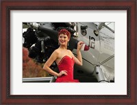 Framed Redhead pin-up girl in 1940's style dancer attire holding on to a vintage aircraft propeller