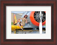 Framed 1940's style pin-up girl posing on a T-6 aircraft