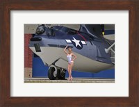 Framed pin-up girl posing with a Catalina seaplane
