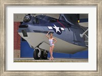 Framed pin-up girl posing with a Catalina seaplane