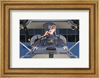 Framed Retro pin-up girl posing with a World War II era PBY Catalina seaplane