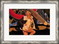 Framed 1940's pin-up girl posing with a vintage T-6 Texan aircraft