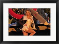 Framed 1940's pin-up girl posing with a vintage T-6 Texan aircraft
