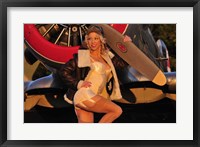 Framed 1940's pin-up girl posing with a vintage T-6 Texan aircraft