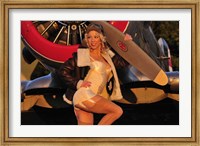 Framed 1940's pin-up girl posing with a vintage T-6 Texan aircraft