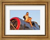 Framed 1940's style aviator pin-up girl posing with a vintage T-6 Texan aircraft