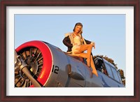 Framed 1940's style aviator pin-up girl posing with a vintage T-6 Texan aircraft