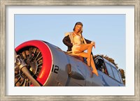 Framed 1940's style aviator pin-up girl posing with a vintage T-6 Texan aircraft
