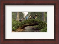 Framed group of Dodo birds crossing a natural bridge over a stream