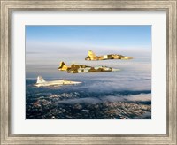 Framed Four F-5 Tiger II's fly above Southern California