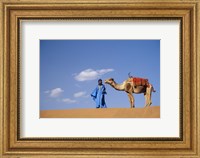 Framed Man leading camel on sand dunes, Tinfou (near Zagora), Morocco, Africa