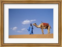 Framed Man leading camel on sand dunes, Tinfou (near Zagora), Morocco, Africa