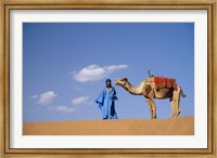 Framed Man leading camel on sand dunes, Tinfou (near Zagora), Morocco, Africa