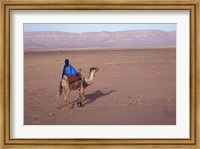 Framed Man in Traditional Dress Riding Camel, Morocco