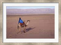 Framed Man in Traditional Dress Riding Camel, Morocco