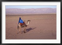 Framed Man in Traditional Dress Riding Camel, Morocco