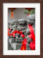 Framed Stone lions with red ribbon, Jade Buddah Temple, Shanghai, China